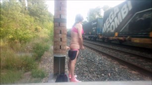 aurelia cuming on train track while riding a dildo