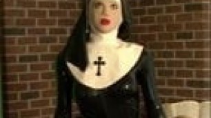 Rubber Nun Poses With Female Silicone Mask