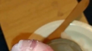 Dipping cock into hot wax