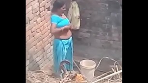 My Neighbour aunty Bathing showing her big boobs&period;